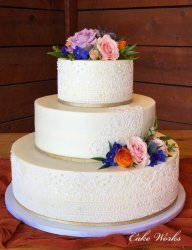Buttercream with sugar lace accents