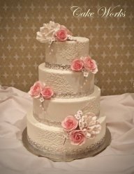 Scroll Pattern on Buttercream with Pink Sugar Flowers